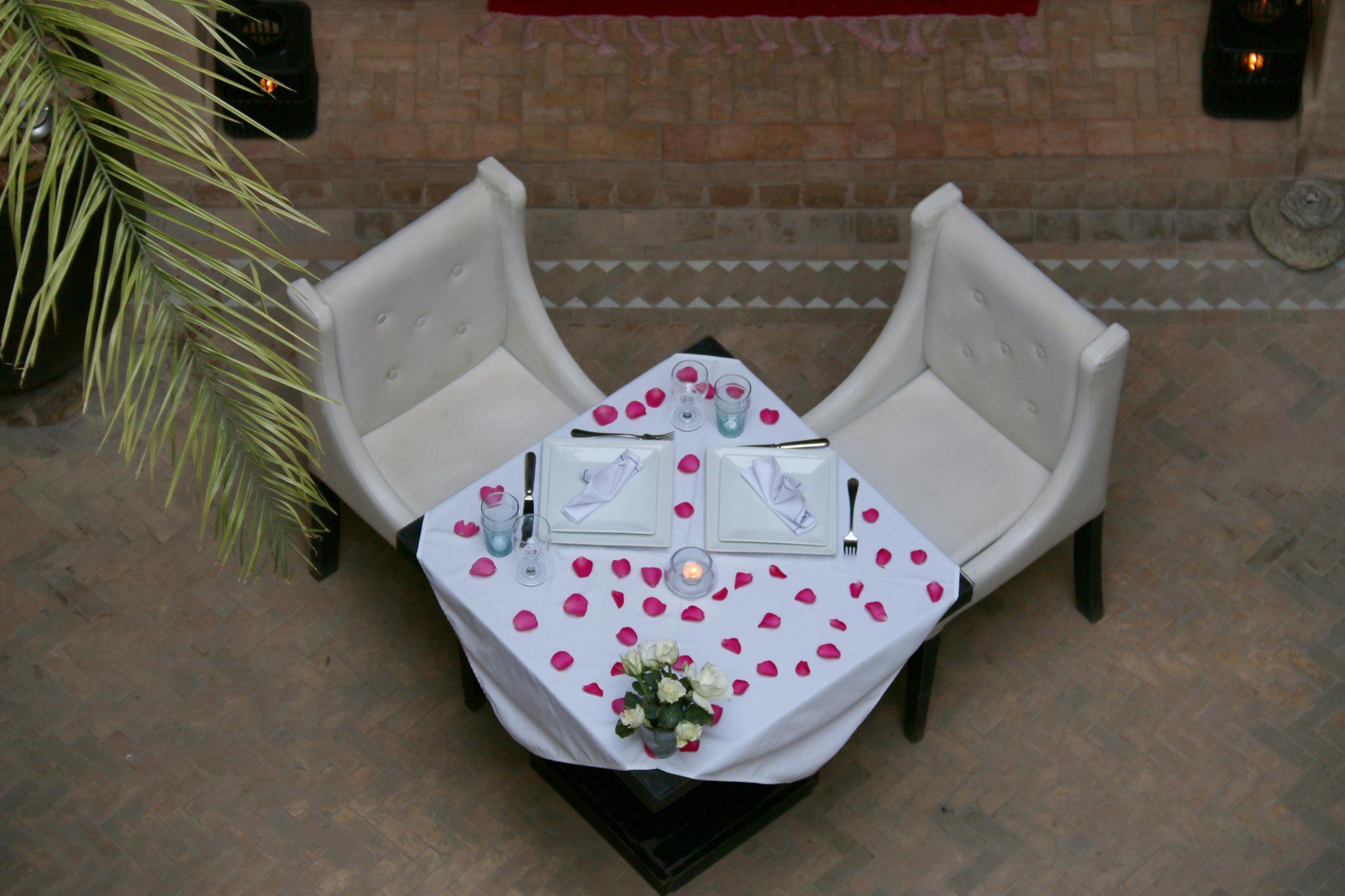 Ambre Epices Medina Riad Marrakesh Exterior photo A table set for a romantic dinner